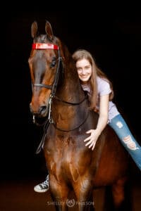 High School Senior Hugging Horse